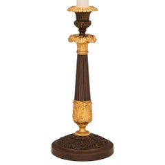 Pair of French 19th Century Charles X St. Bronze and Ormolu Candlestick Lamps