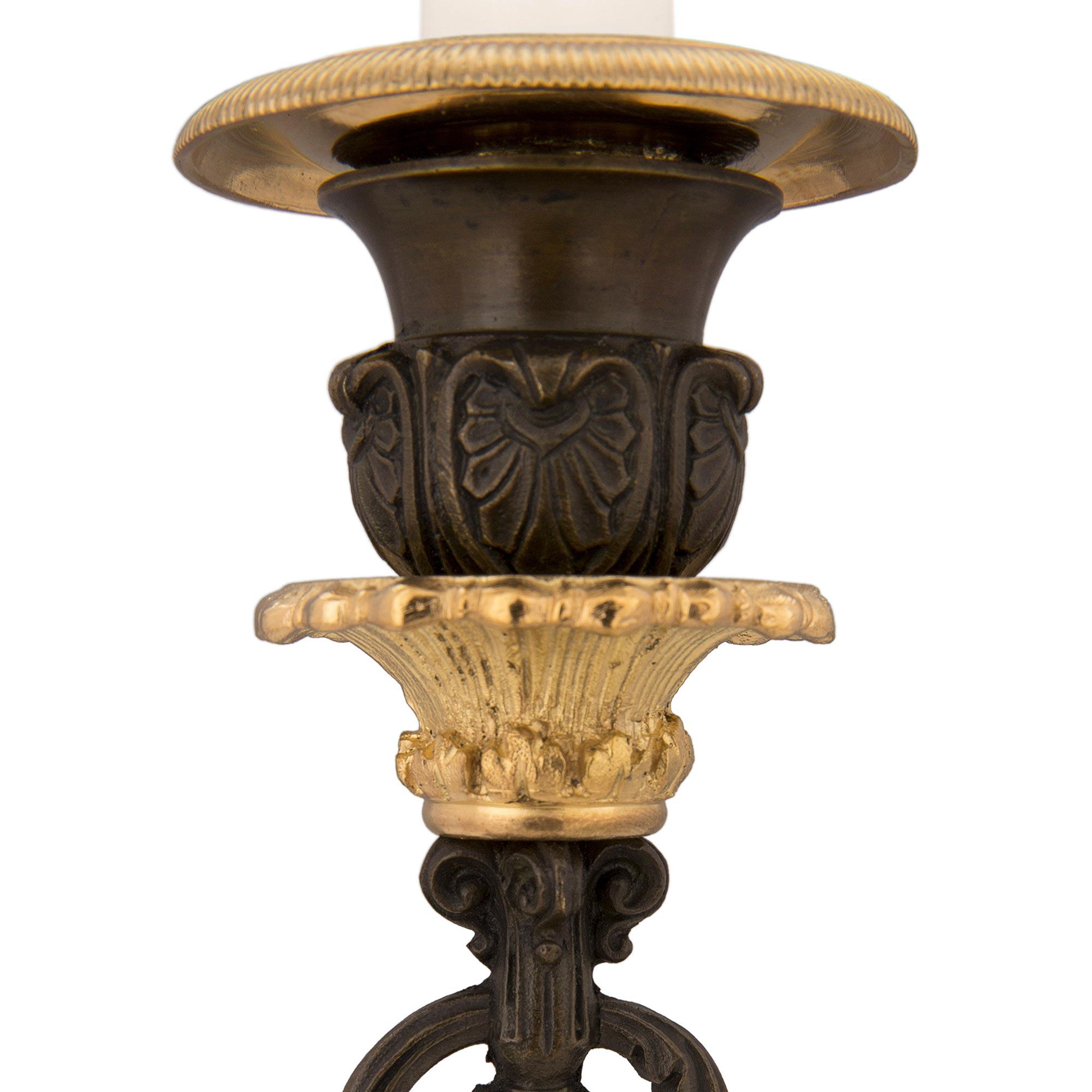 Pair of French 19th Century Charles X Style Bronze and Ormolu Candlesticks For Sale 1