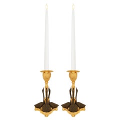 pair of French 19th century Directoire st. Bronze and Ormolu candlesticks