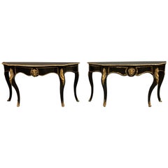 Pair of French 19th Century Ebonized Console Tables with Brass Mounts