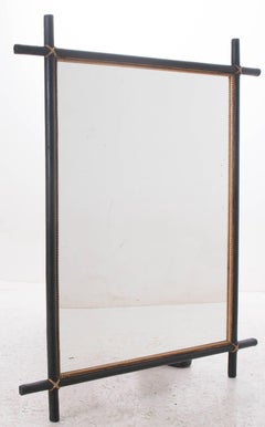 Pair of French 19th Century Ebonized and Parcel-Gilt Mirrors