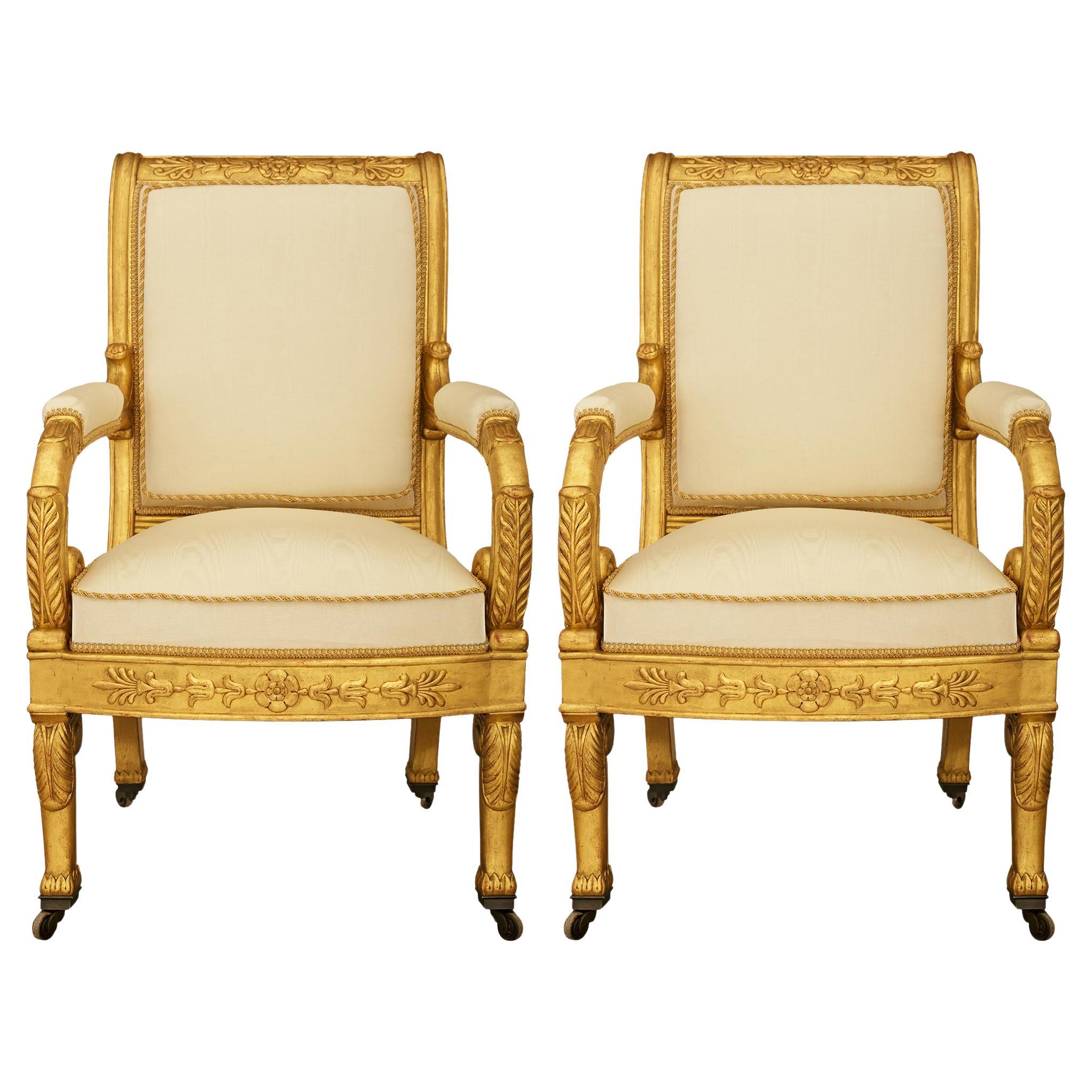 pair of French 19th century Empire st. Giltwood armchairs