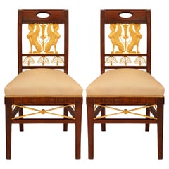 pair of French 19th century Empire st. Mahogany and Ormolu side chairs