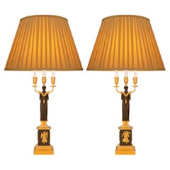 pair of French 19th century Empire st. Patinated Bronze and Ormolu lamps