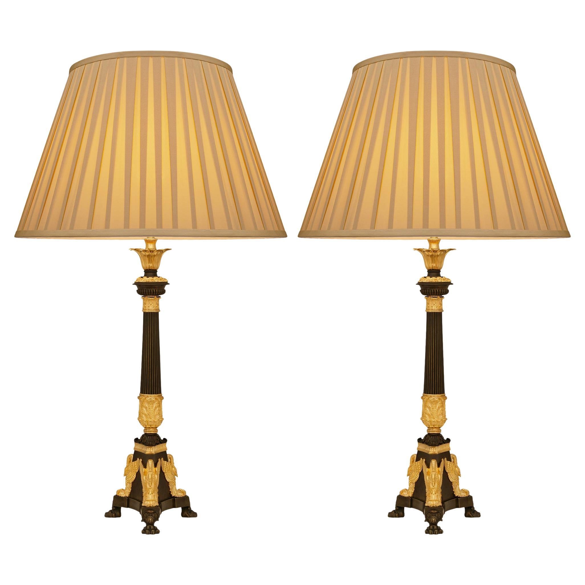 Paire de lampes en bronze patiné et bronze doré de style Empire du 19e siècle