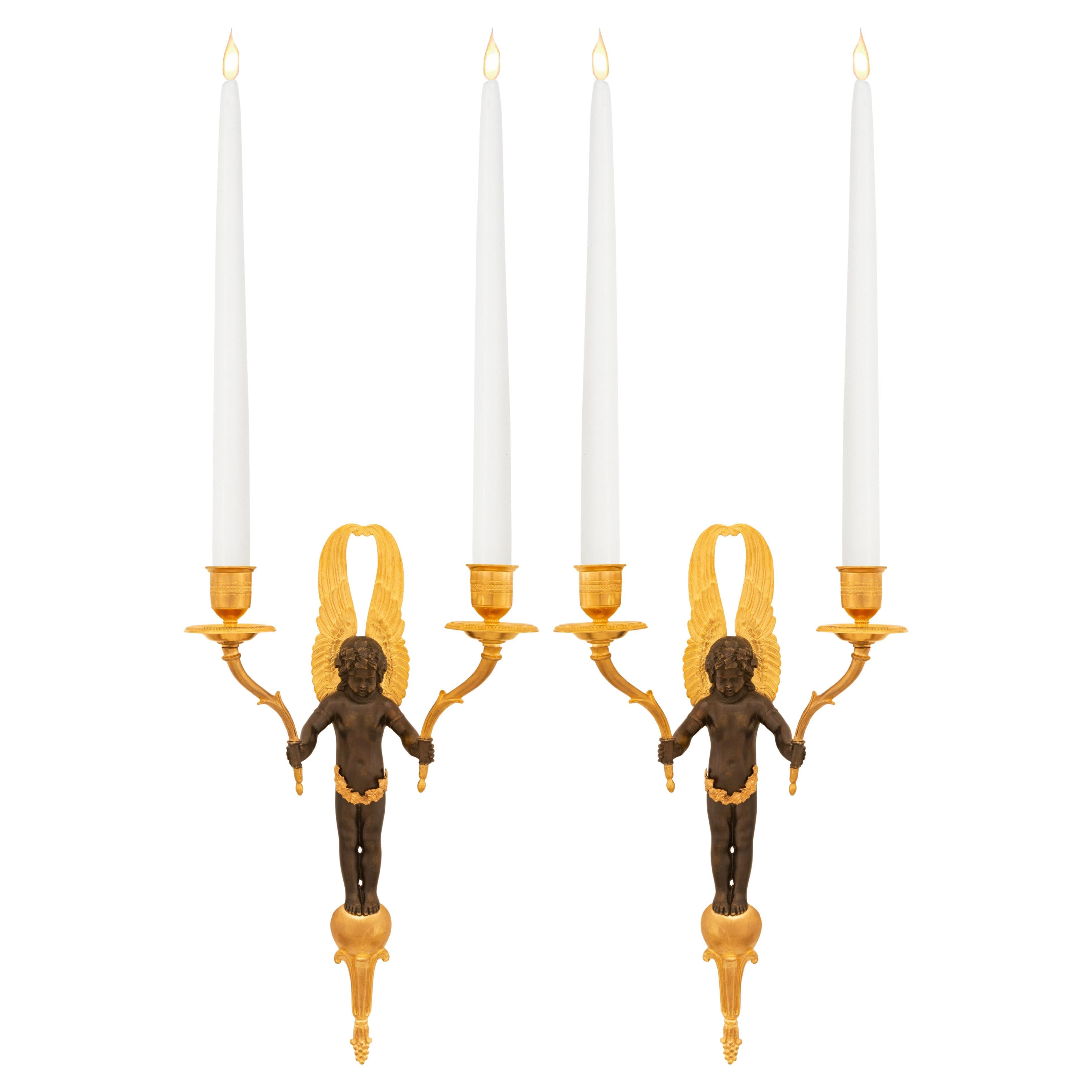 pair of French 19th century Empire st. patinated Bronze and Ormolu sconces