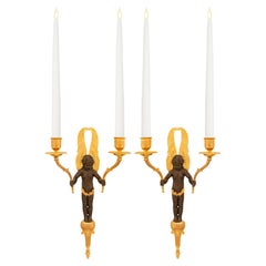 pair of French 19th century Empire st. patinated Bronze and Ormolu sconces