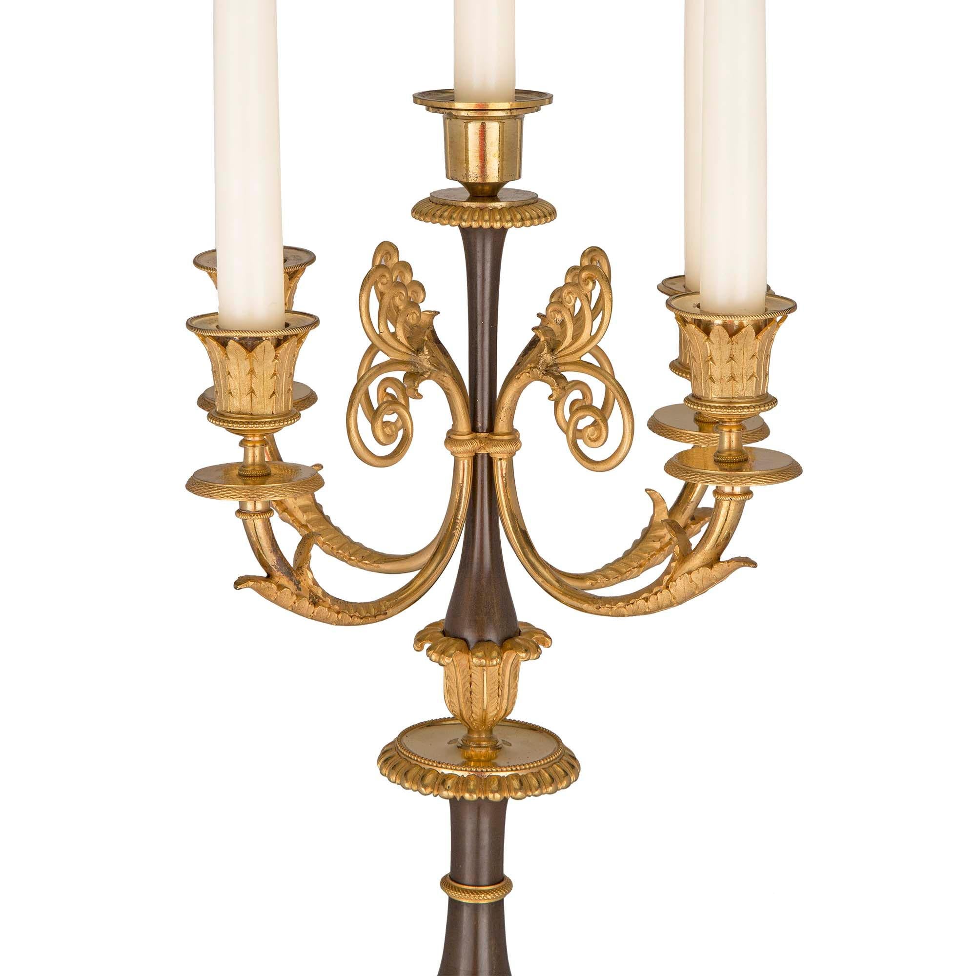 Patinated Pair of French 19th Century First Empire Period Bronze and Ormolu Candelabras For Sale