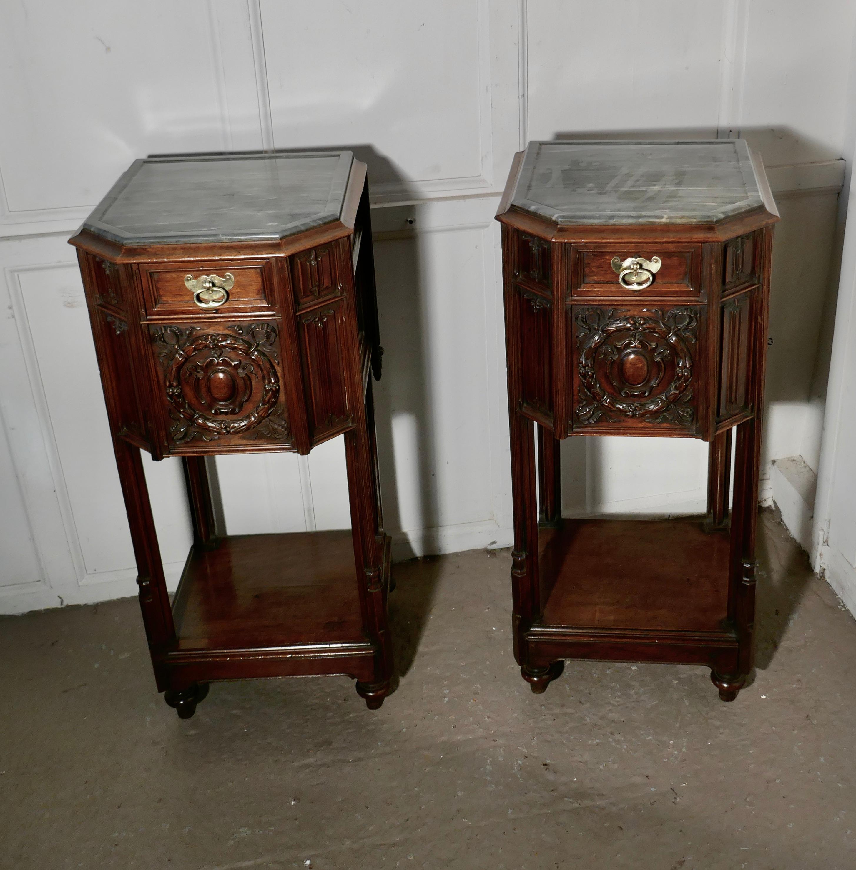 Pair of French 19th century Gothic oak bedside cupboards 

This is a rare pair of 19th century Gothic oak bedside cabinets, 

The cabinets have mottled grey marble tops which have a shaped raised edge to the front, each cabinet has a small