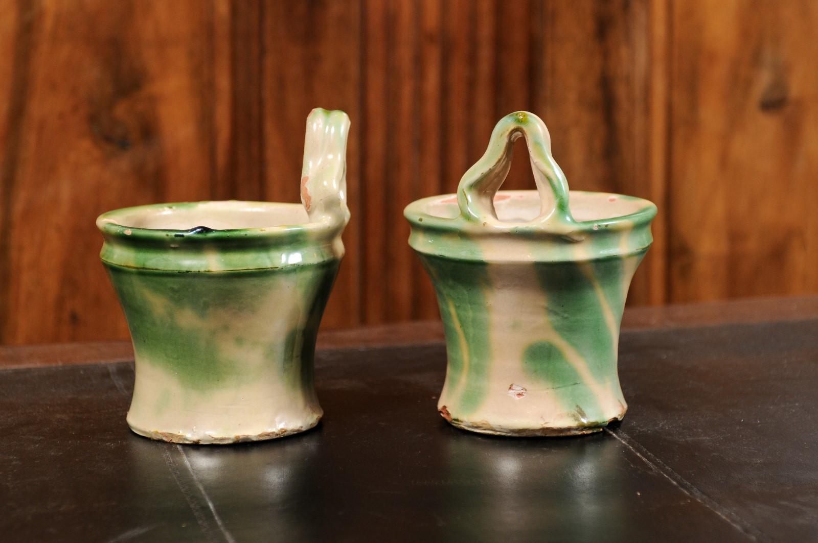 Pair of French 19th Century Green and Yellow Glazed Pottery Hanging Planters In Good Condition For Sale In Atlanta, GA