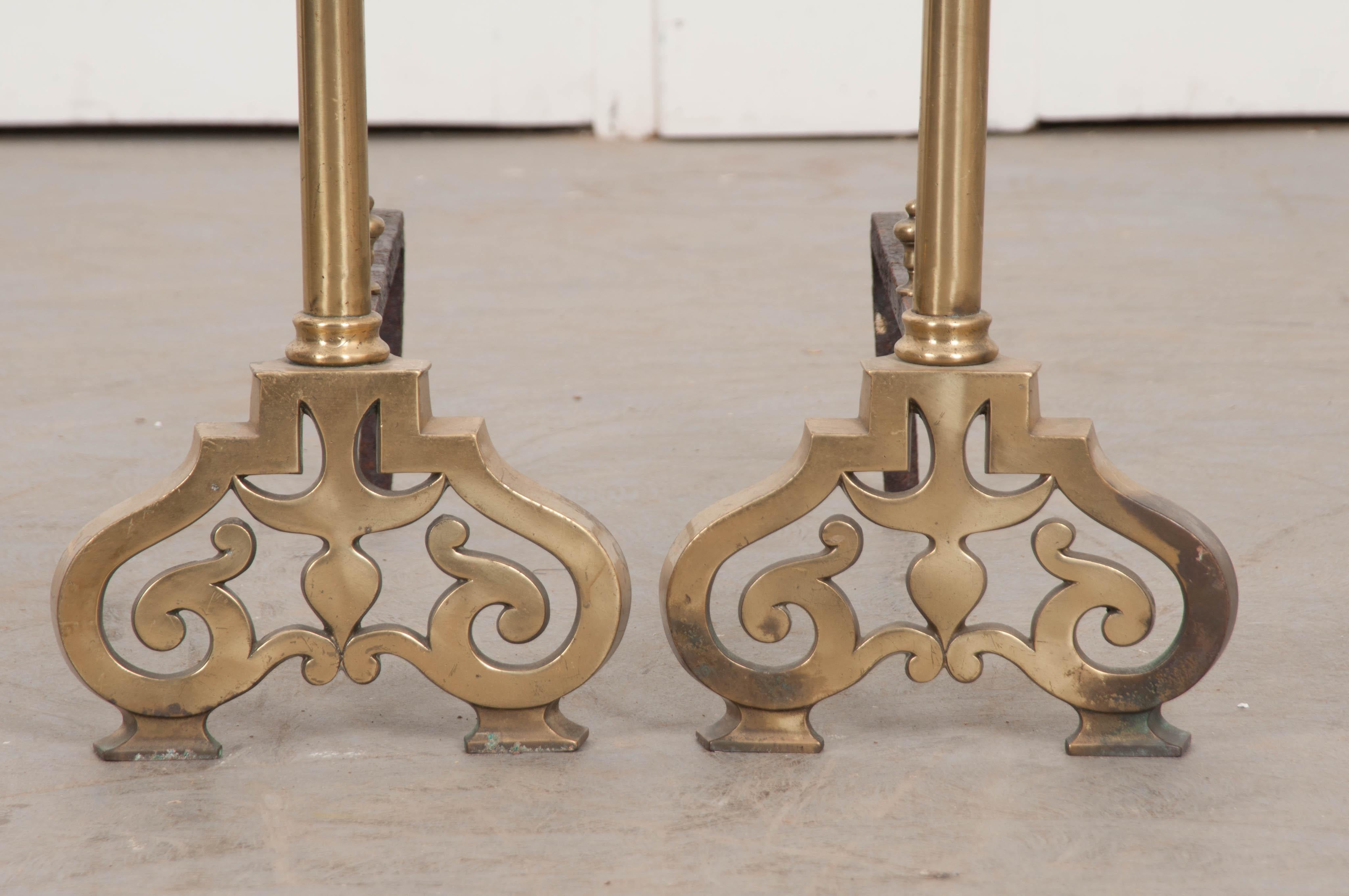 This handsome pair of Louis XIII-style iron and brass chenets, or andirons, circa 1800, is from France and will brighten up your fireplace year round!