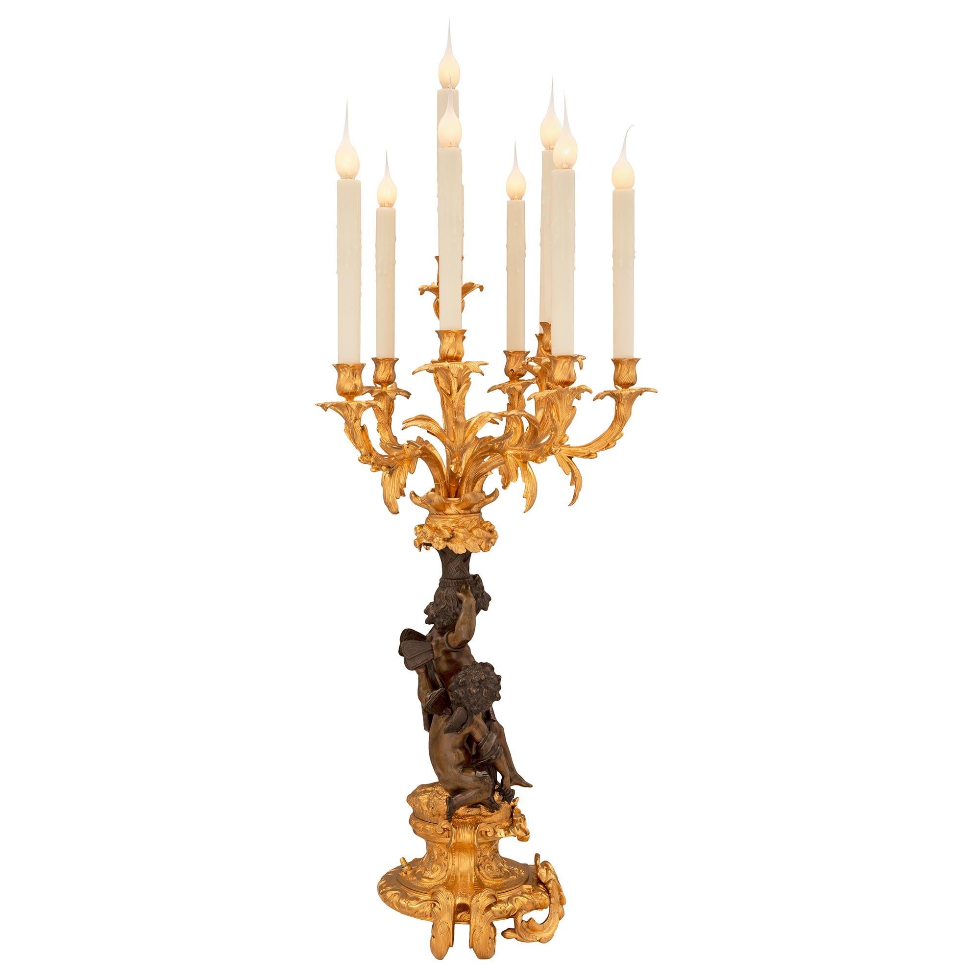 Patinated Pair of French 19th Century Louis XV St. Bronze and Ormolu Candelabra Lamps For Sale