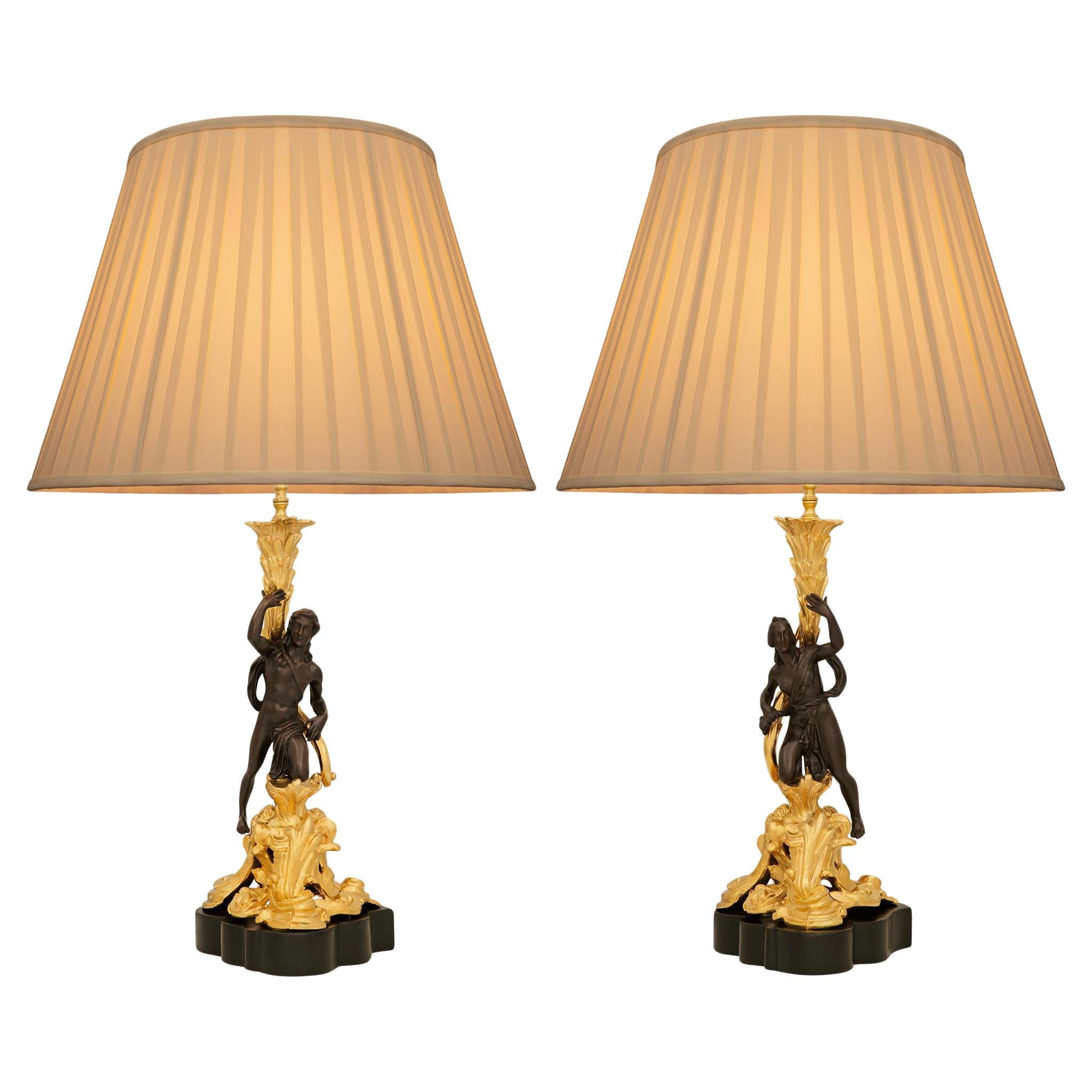 pair of French 19th century Louis XV st. Bronze, Wood, and Ormolu lamps