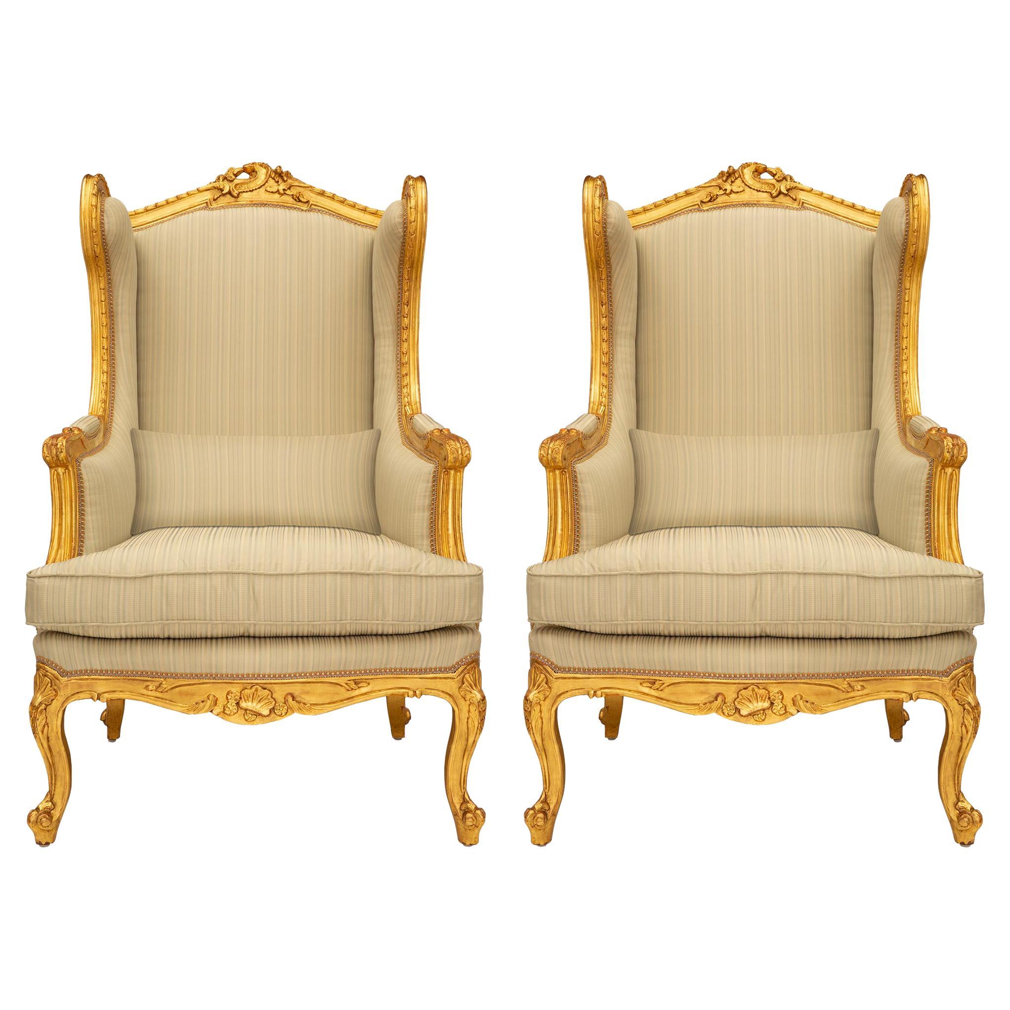 Pair of French 19th Century Louis XV St. Giltwood Bergères À Oreilles Armchairs For Sale