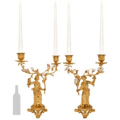 Pair of French 19th century Louis XV st. Ormolu and Saxe Porcelain candelabras