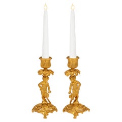 Pair of French 19th Century Louis XV St. Ormolu Cherub Candlesticks