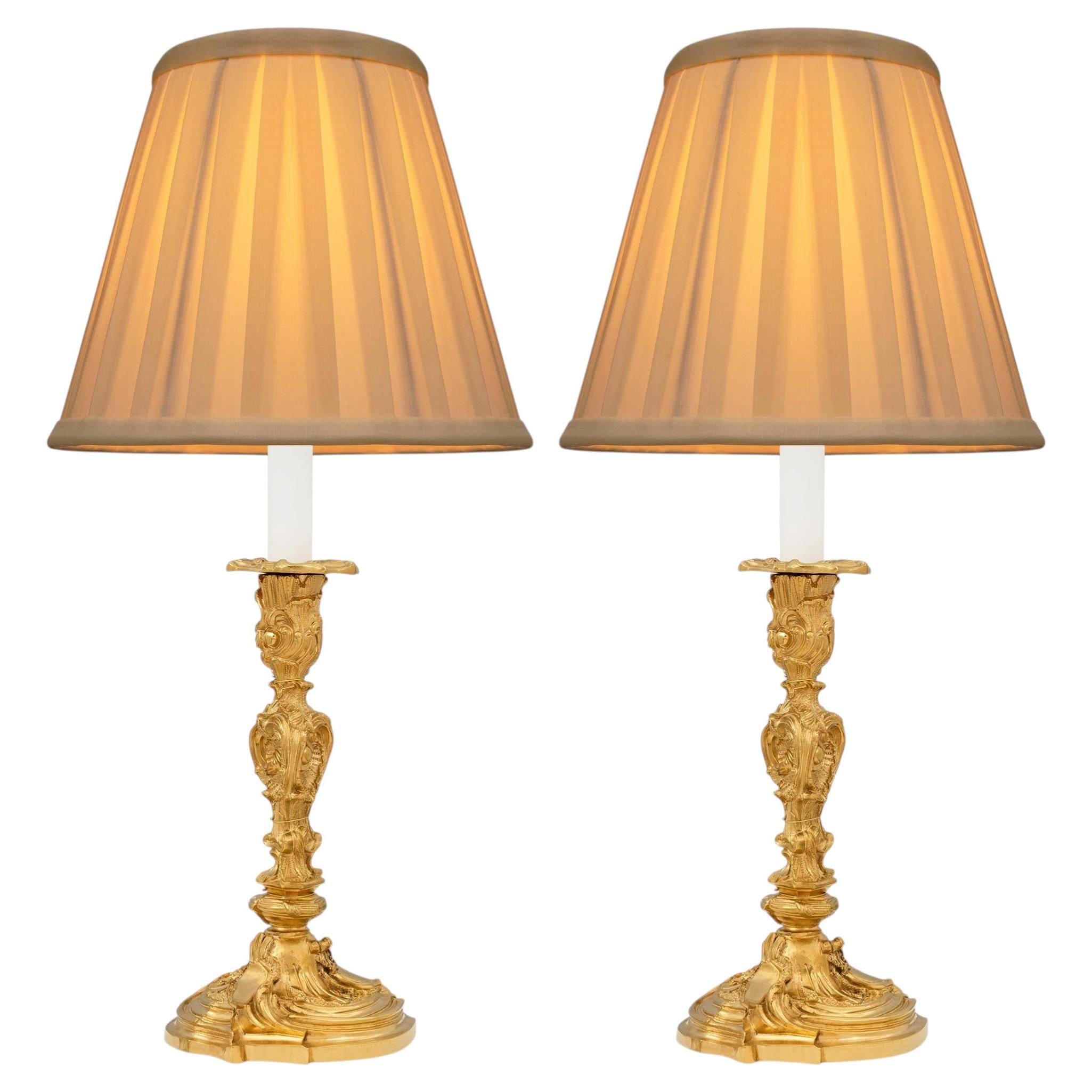 pair of French 19th century Louis XV st. Ormolu lamps, signed G.G.
