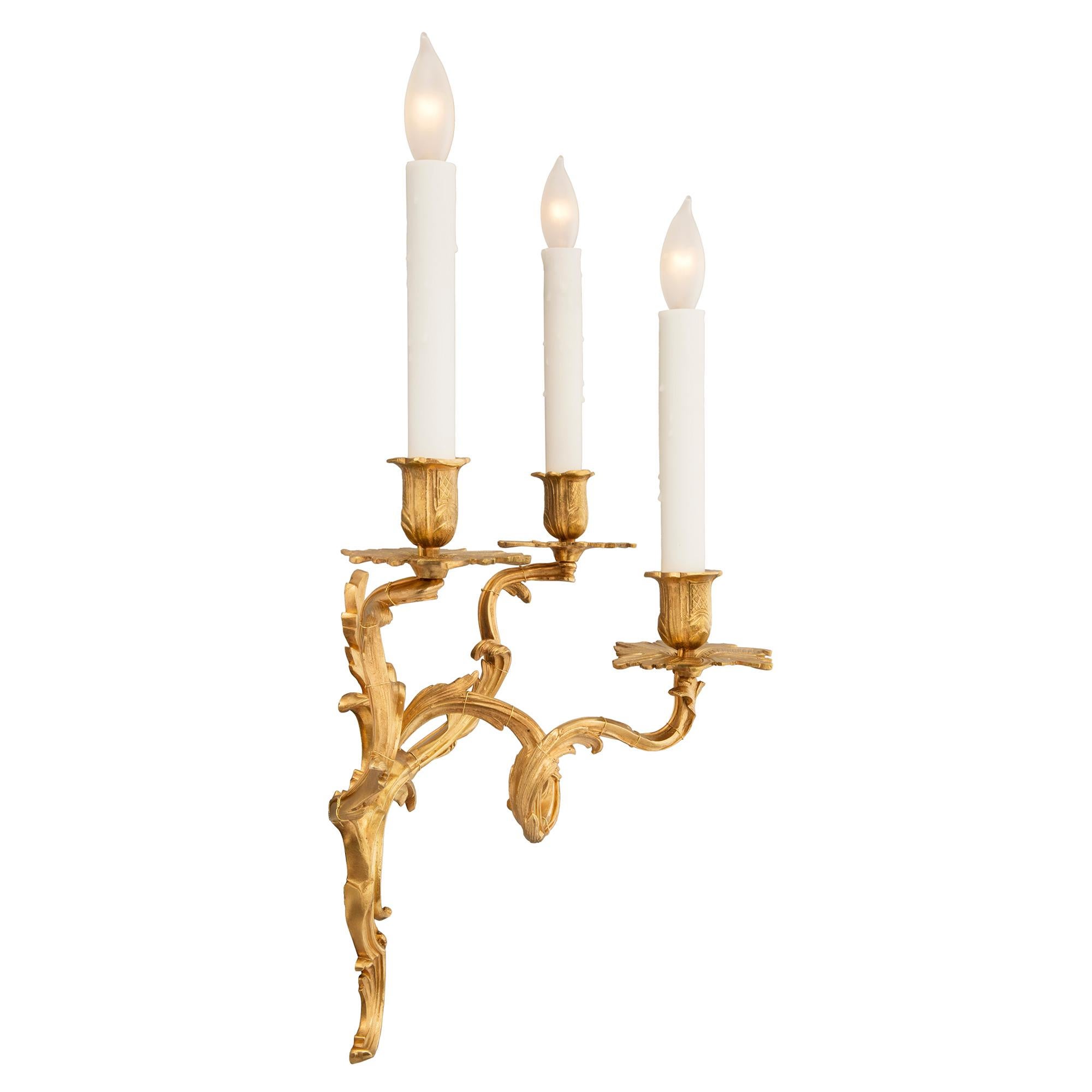 Pair of French 19th Century Louis XV St. Ormolu Three-Arm Sconces In Good Condition For Sale In West Palm Beach, FL