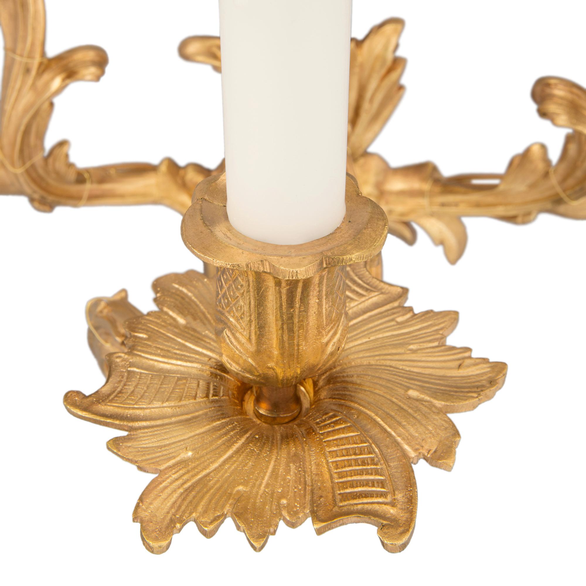Pair of French 19th Century Louis XV St. Ormolu Three-Arm Sconces For Sale 3