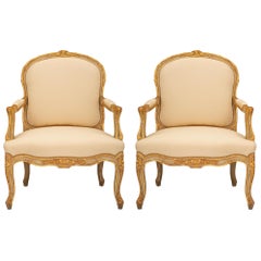 Pair of French 19th Century Louis XV St. Patinated and Giltwood Armchairs