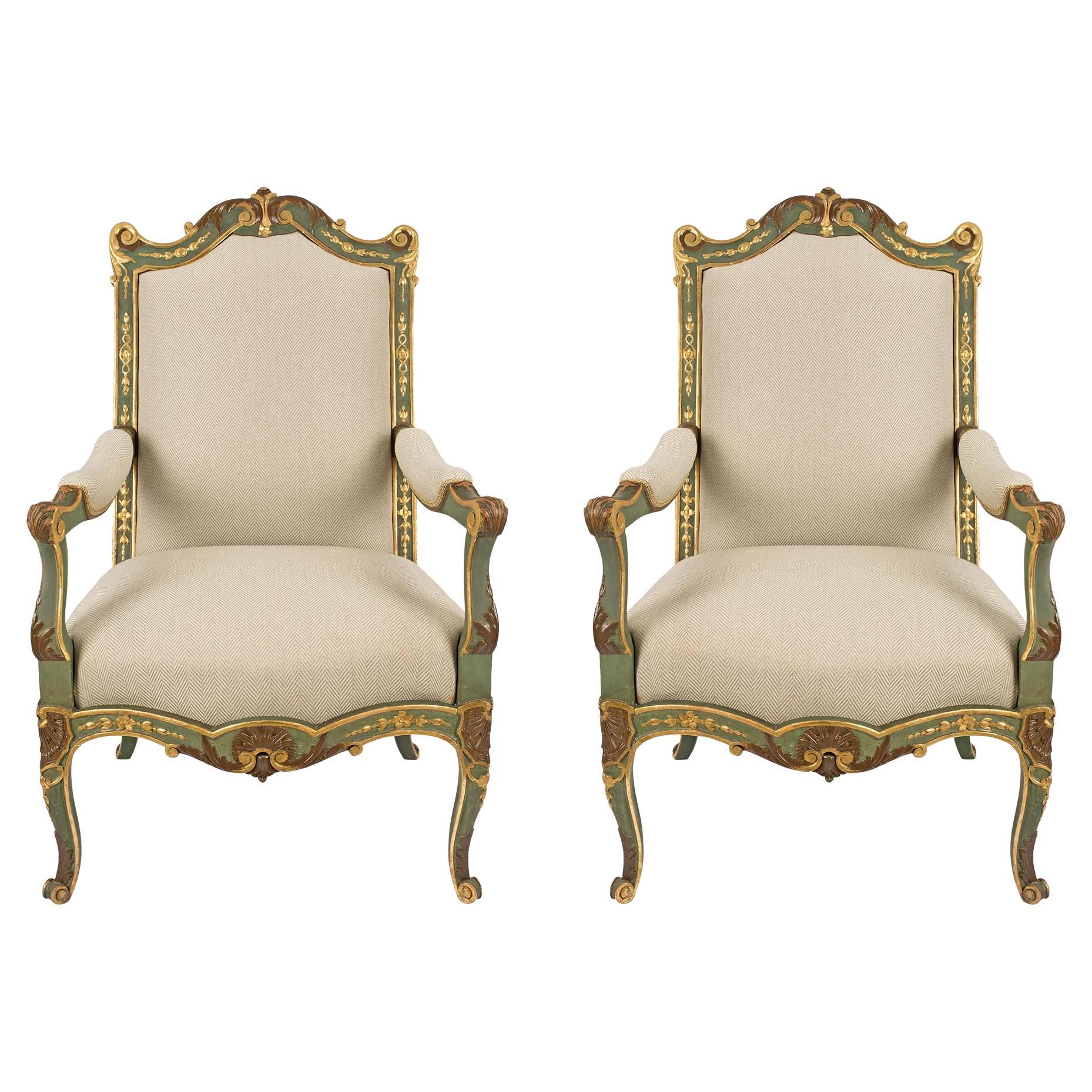 pair of French 19th century Louis XV st. patinated and Giltwood armchairs