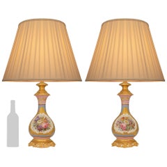 pair of French 19th century Louis XV st. Sévres Porcelain and Ormolu lamps