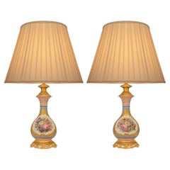pair of French 19th century Louis XV st. Sévres Porcelain and Ormolu lamps