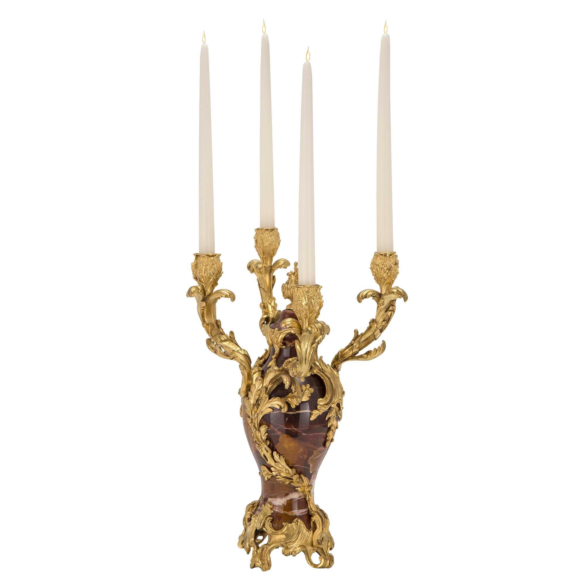 A magnificent pair of French 19th century Louis XV st. finely chased ormolu and marble candelabras, signed F. Linke. Each four arm candelabra is raised on a pierced scrolled ormolu base, with very impressive ormolu foliate wrapping up the marble