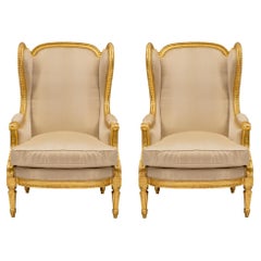 Pair of French 19th Century Louis XV Style Giltwood Bergères À Oreilles