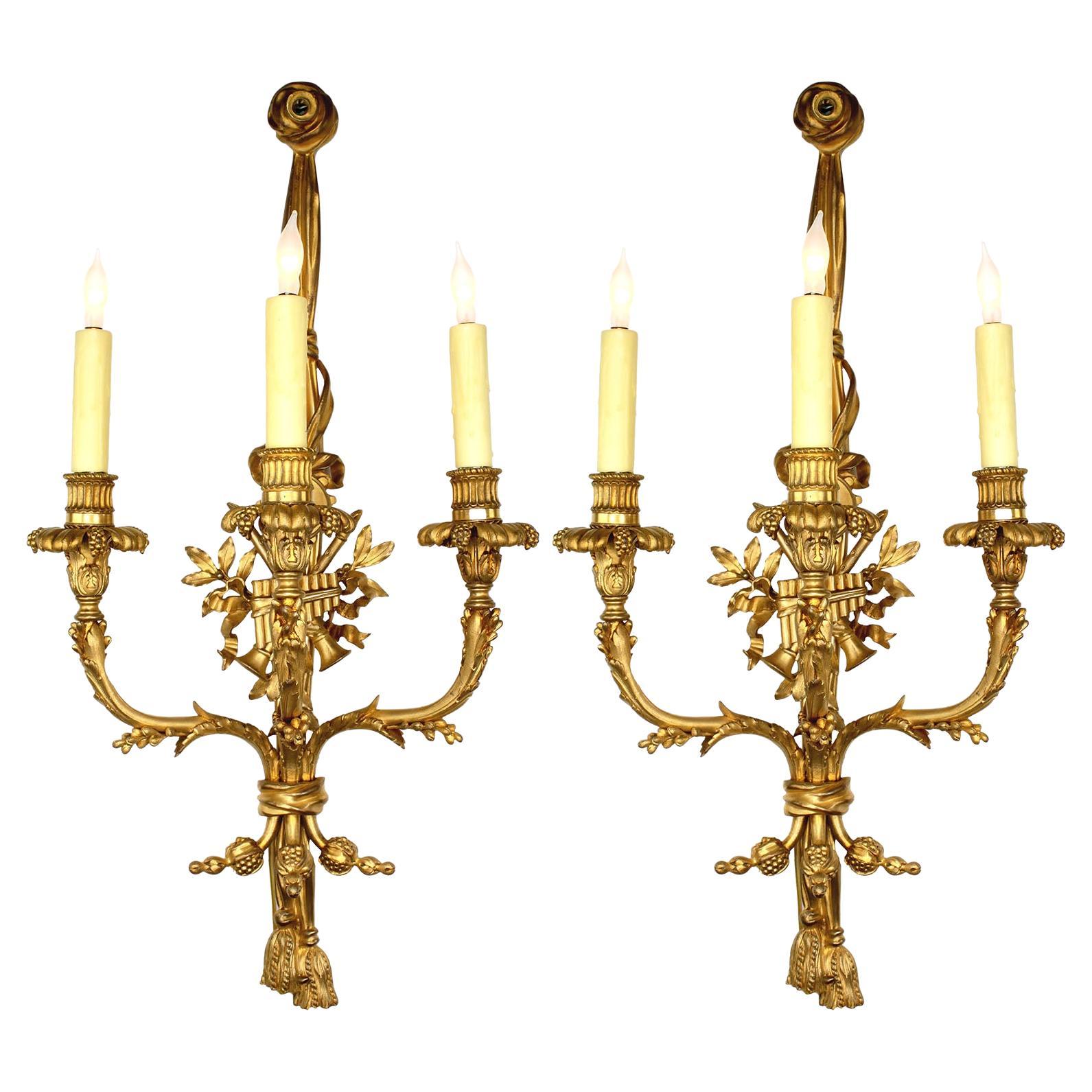 Pair of French 19th Century Louis XV Style Three-Light Gilt-Bronze Wall Sconces
