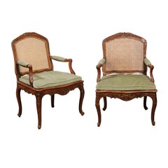 Pair of French 19th Century Louis XV Style Walnut and Cane Upholstered Armchairs