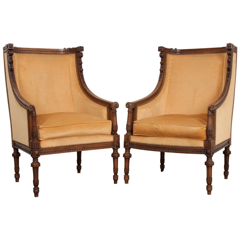 Pair of French 19th Century Louis XVI Carved Walnut Bergères at 1stDibs