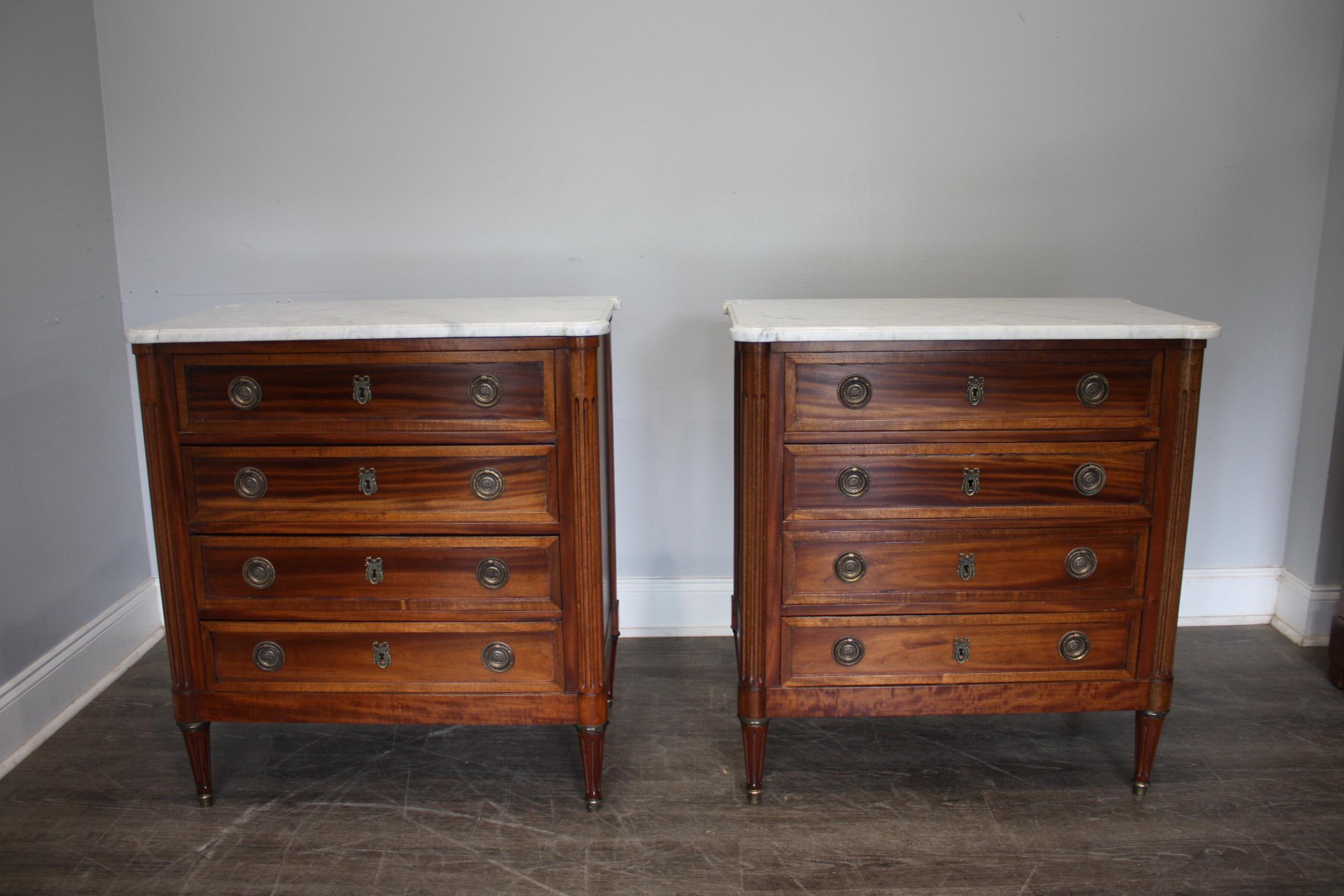 Wonderful Pair of late 19th century Commode, very hard to found pair. They are in flamed mahogany wood with a white with grey veins marble top.