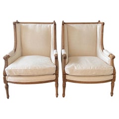 Used  Pair of French 19th Century Louis XVI Intricately Carved Wingback Club Chairs