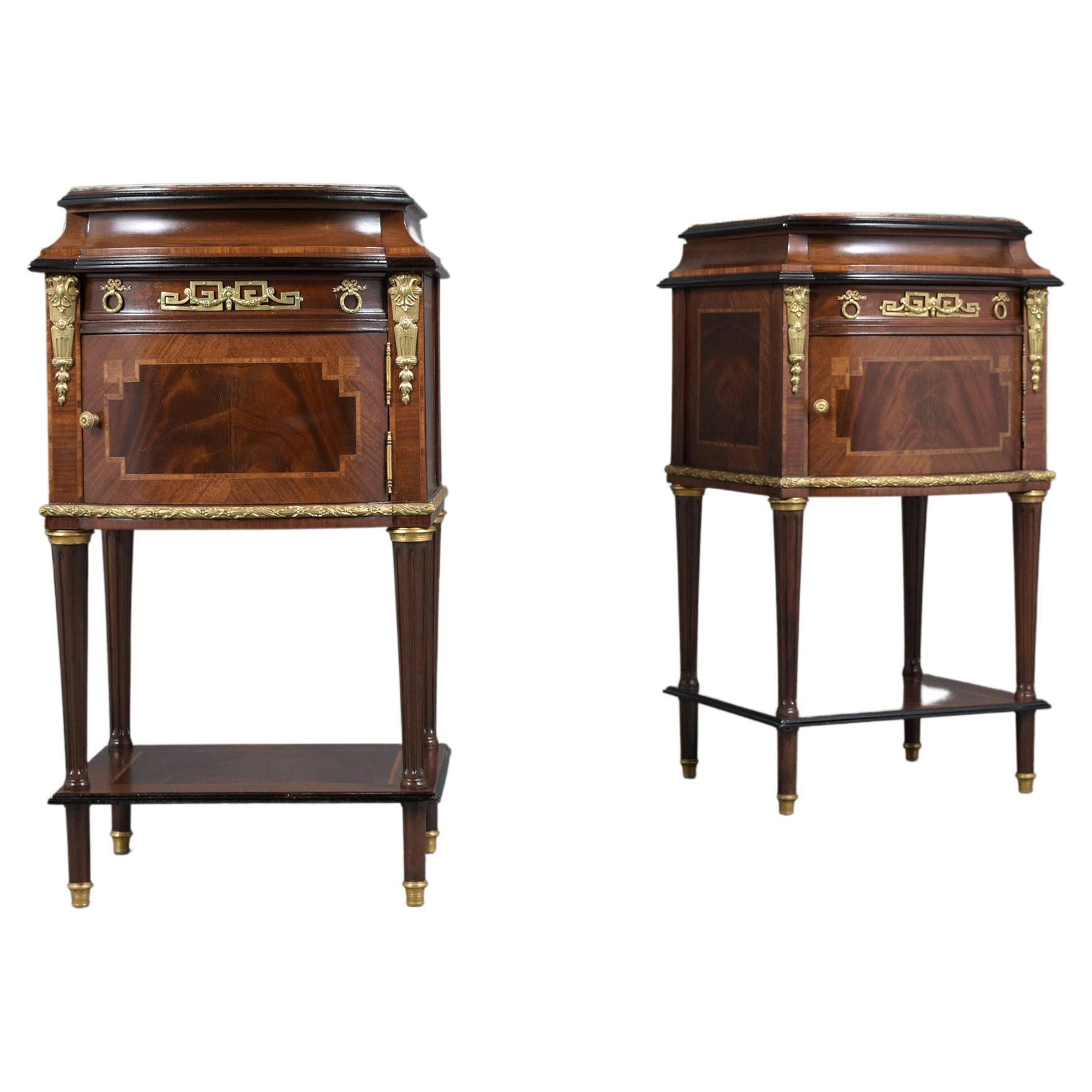 An extraordinary pair of antique french Lois XVI style nightstands beautifully crafted out of mahogany wood & marble combination in great condition professionally restored by our craftsmen team. This fantastic set of side tables features deep rich