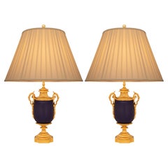 Pair of French 19th century Louis XVI st. blue Sévres Porcelain, Ormolu lamps
