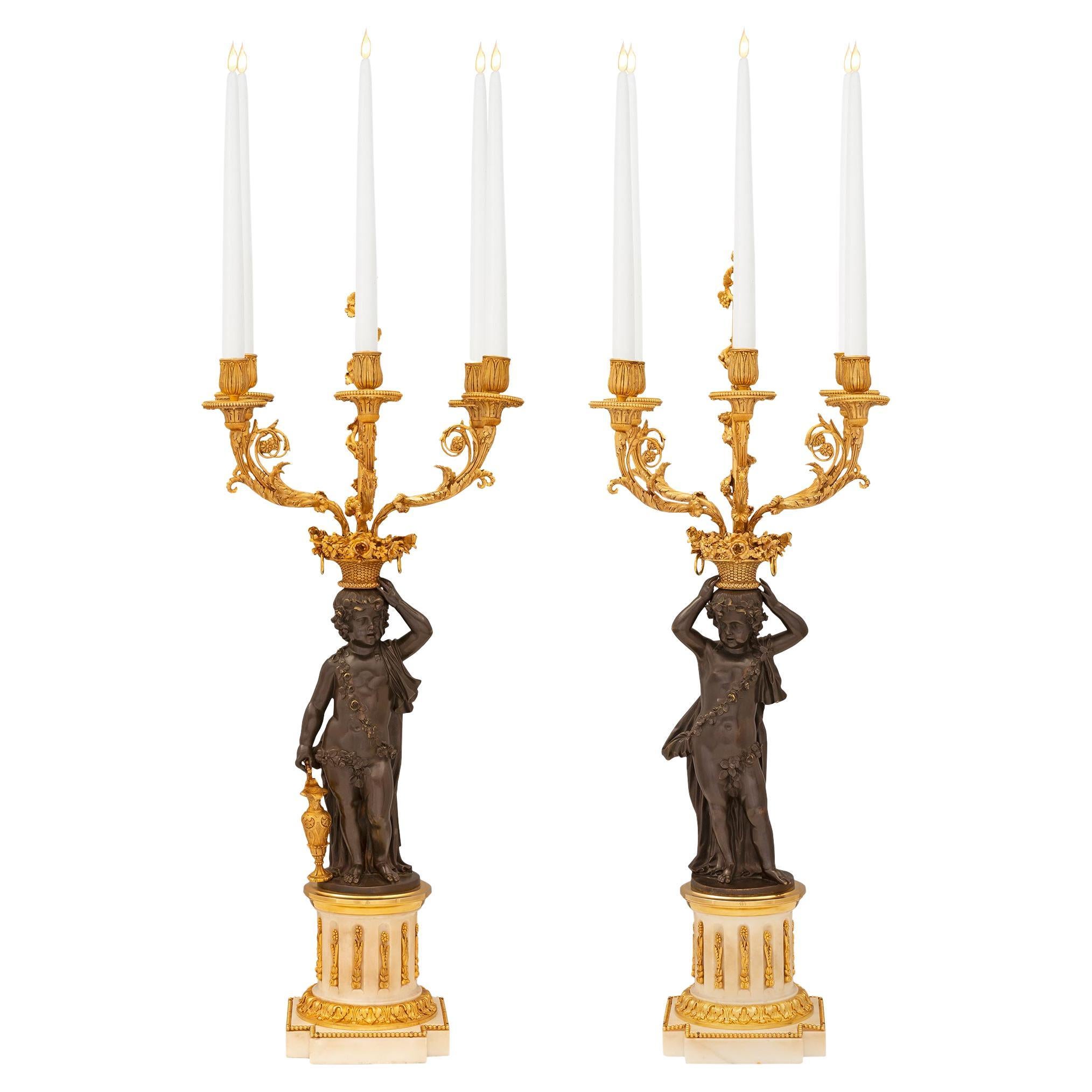Paire de candélabres français du 19ème siècle de style Louis XVI en bronze et similor