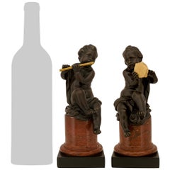 pair of French 19th century Louis XVI st. Bronze, Ormolu, and marble statues
