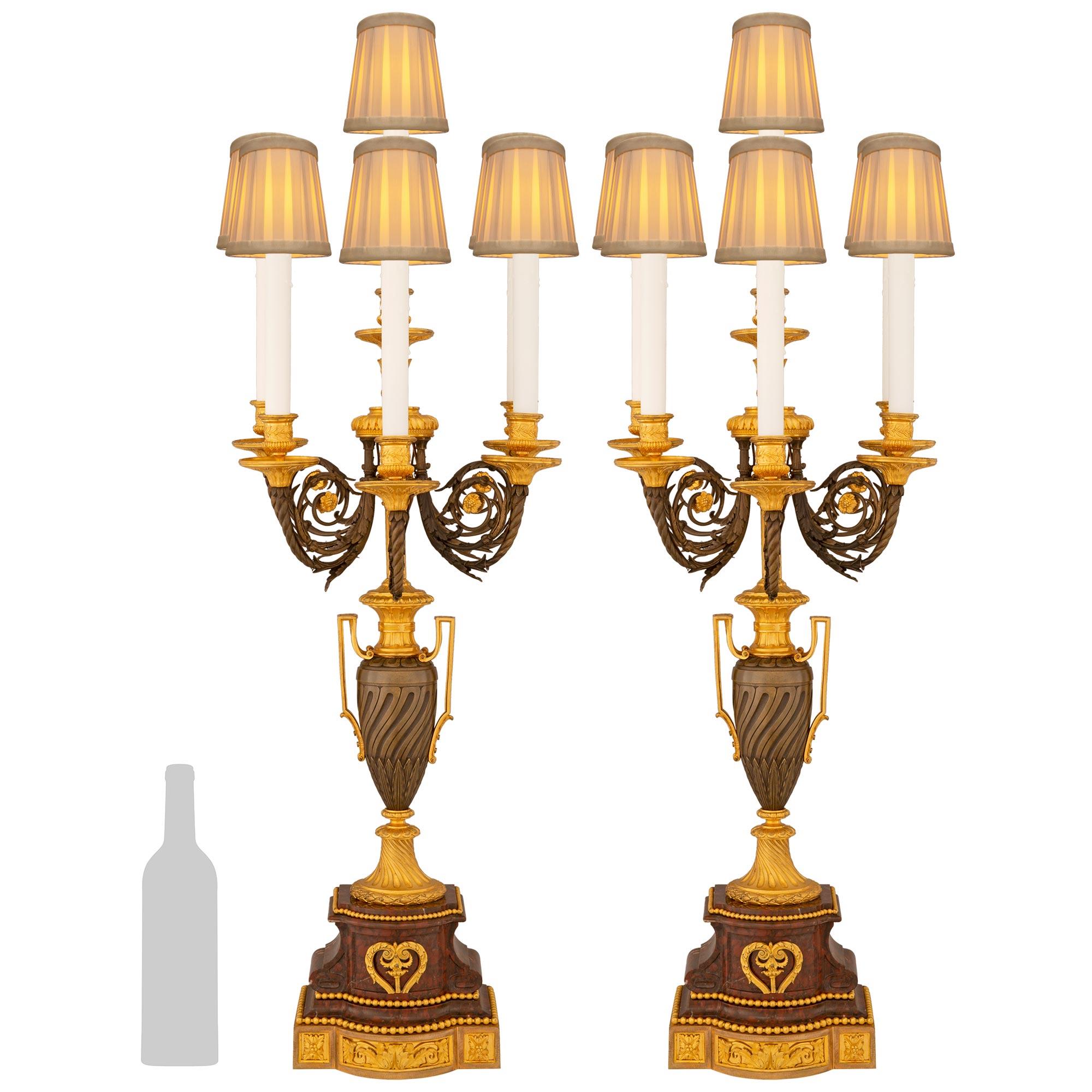 
A sensational and high quality pair of French 19th century Louis XVI st. Ormolu, patinated Bronze and Rouge Griotte marble candelabra lamps, signed H. Picard. Each stunning electrified candelabra is raised on an Ormolu plinth with a protruding