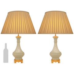 pair of French 19th century Louis XVI st. Celadon porcelain and Ormolu lamps