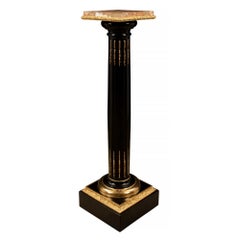 pair of French 19th century Louis XVI st. Ebony, Ormolu and Marble pedestals