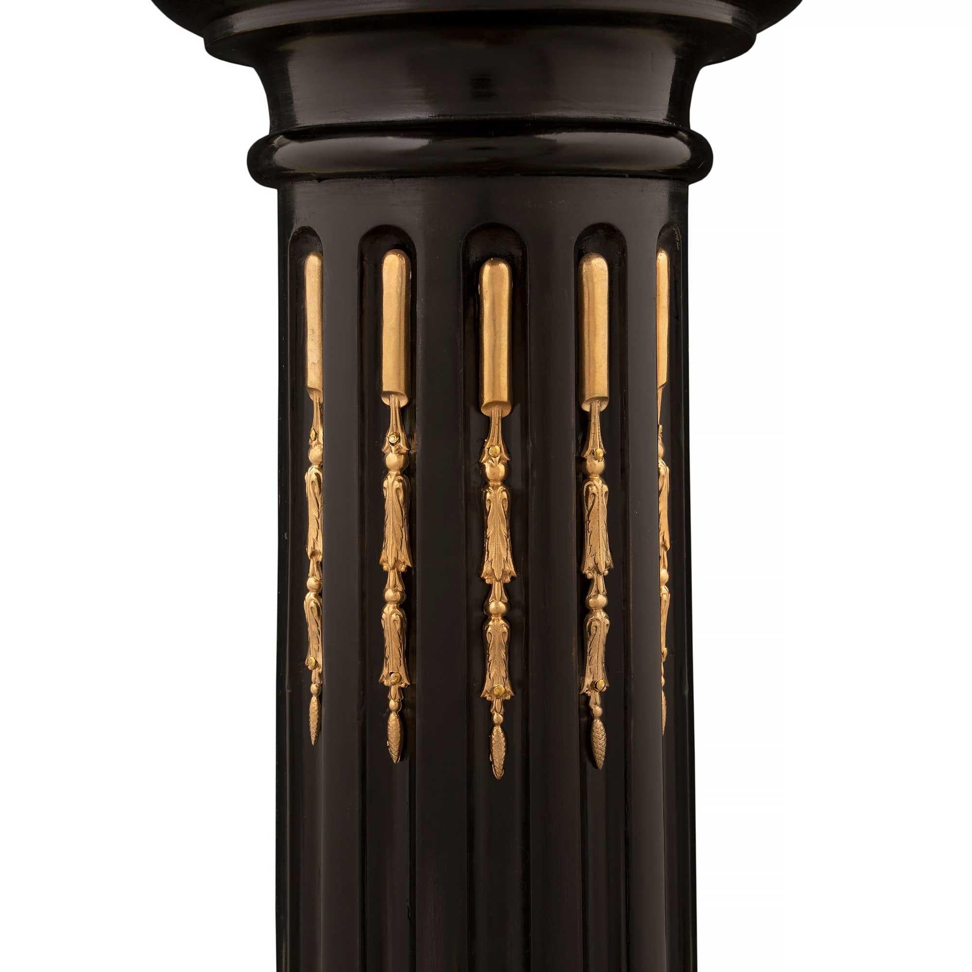 19th Century pair of French 19th century Louis XVI st. Ebony, Ormolu and Marble pedestals For Sale