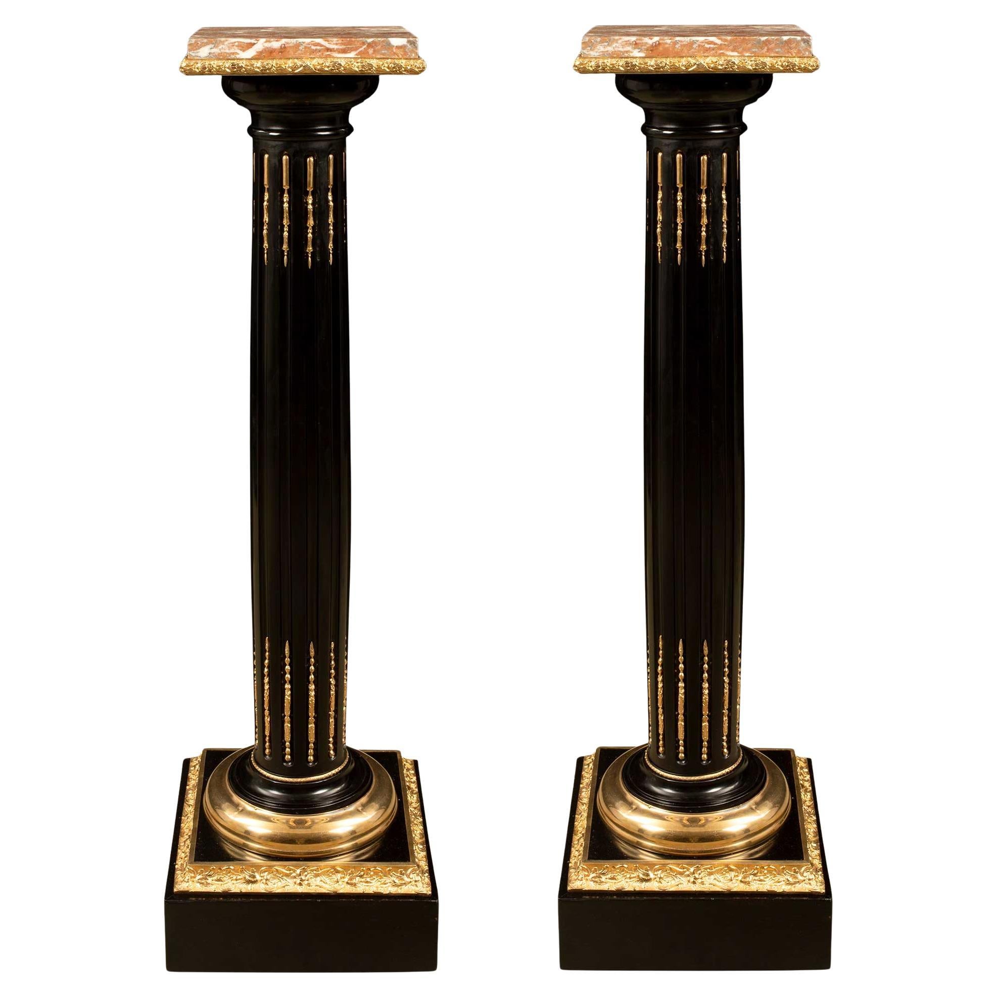 pair of French 19th century Louis XVI st. Ebony, Ormolu and Marble pedestals
