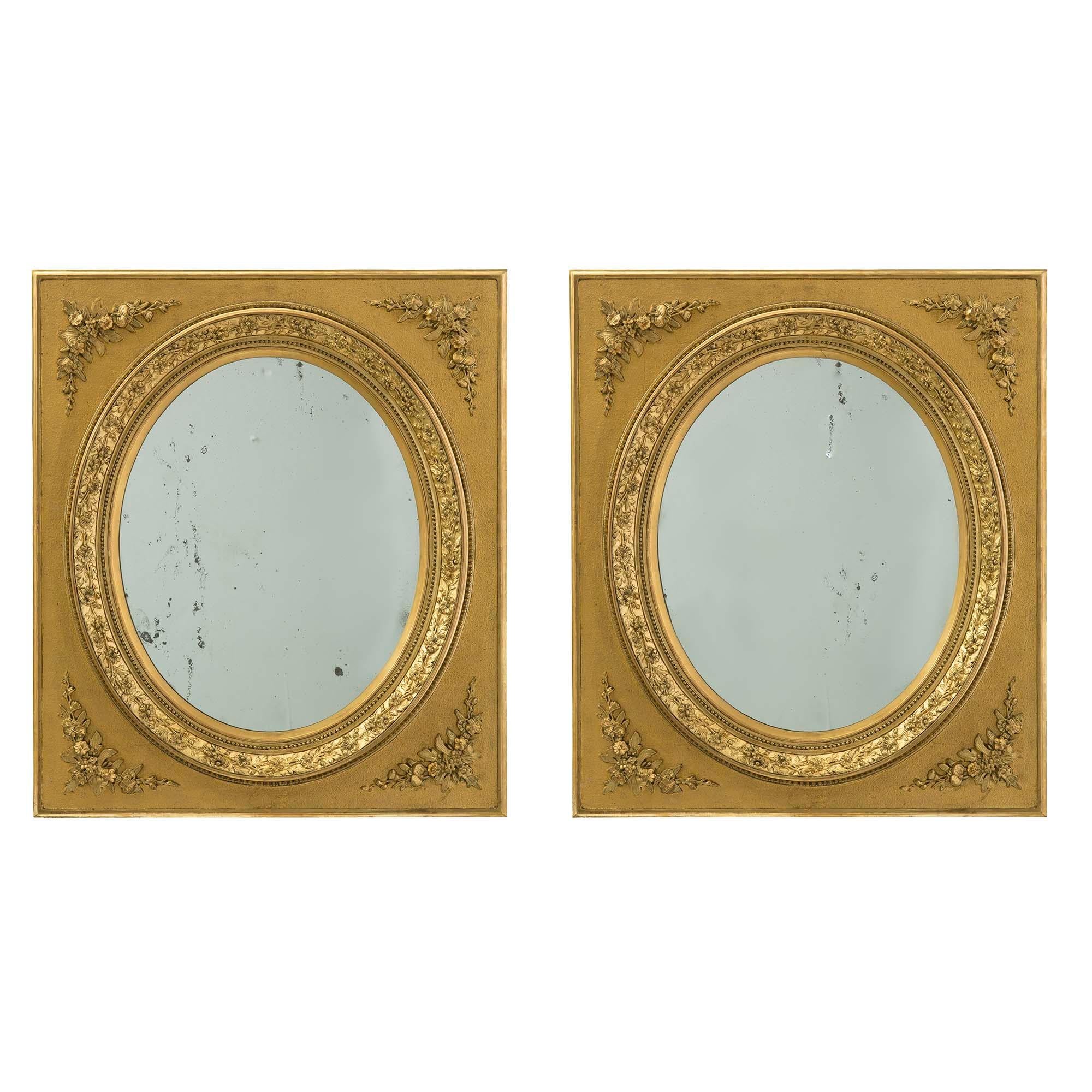 Pair of French 19th Century Louis XVI St. Gilt Wood Mirrors For Sale