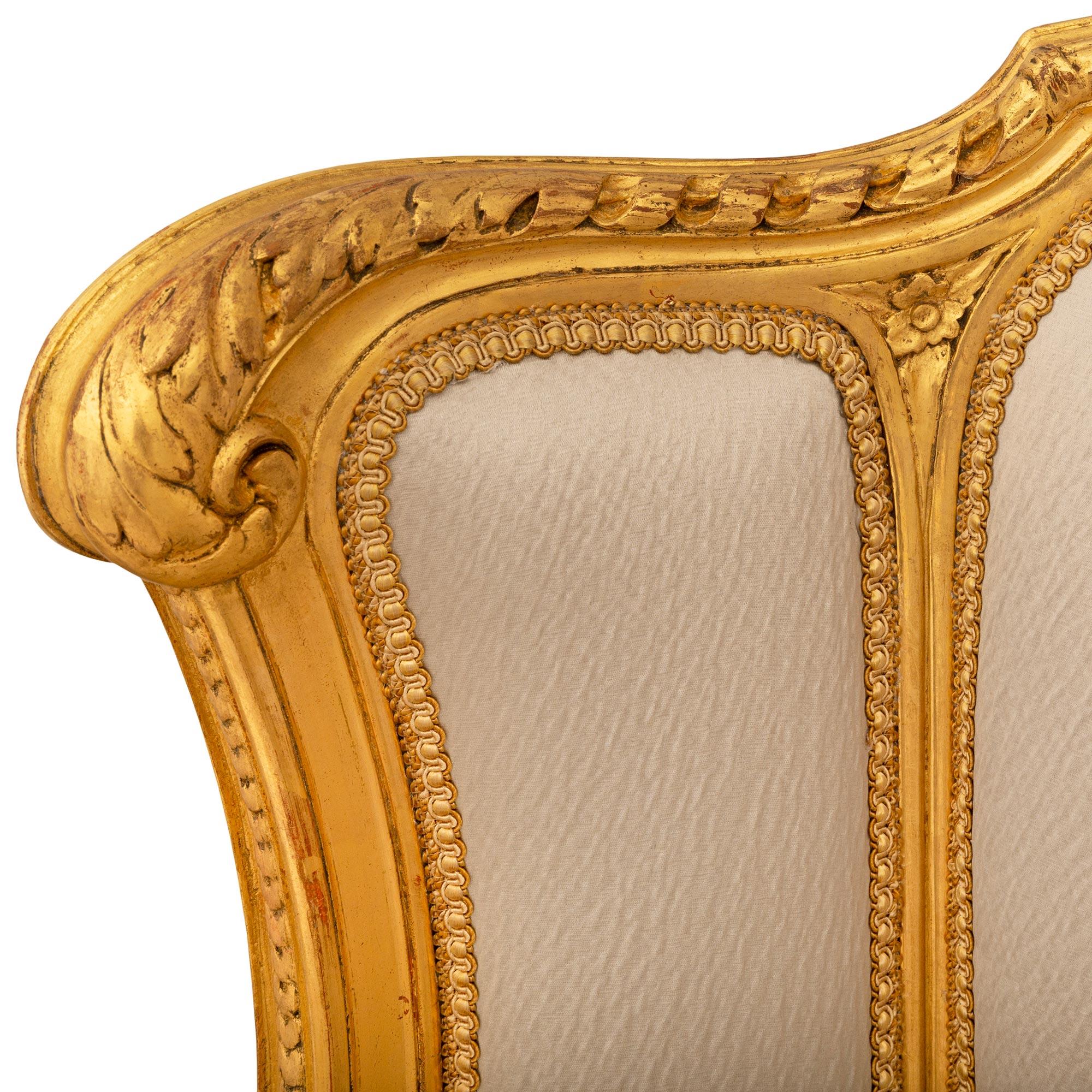 Pair Of French 19th Century Louis XVI St. Giltwood Bergère Armchairs For Sale 1