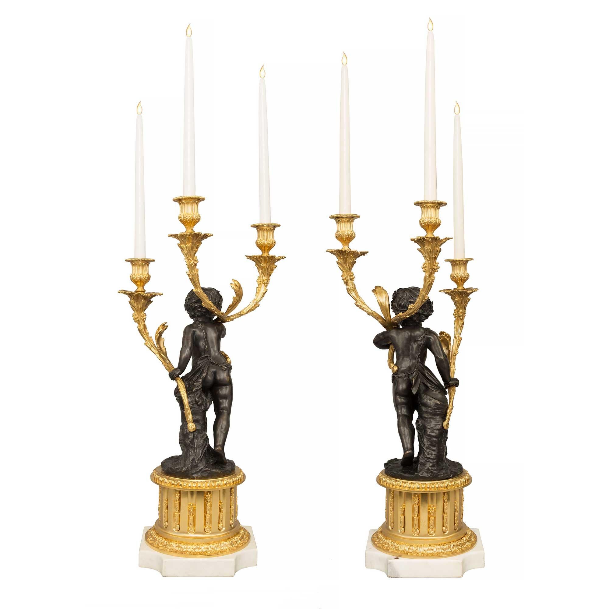 Patinated Pair of French 19th Century Louis XVI St. Ormolu and Bronze Candelabras For Sale