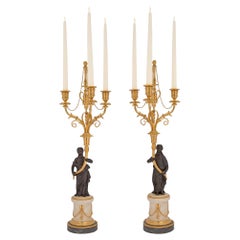 Pair of French 19th Century Louis XVI St. Ormolu and Bronze Candelabras