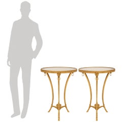 pair of French 19th century Louis XVI st. Ormolu and Carrara marble side tables