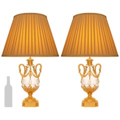 pair of French 19th century Louis XVI st. Ormolu and Crystal lamps