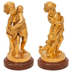 Pair of French 19th Century Louis XVI St. Ormolu and Marble Statues